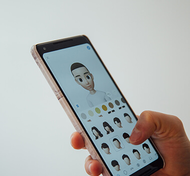 Right hand carrying touch mobile with an app appearing on screen